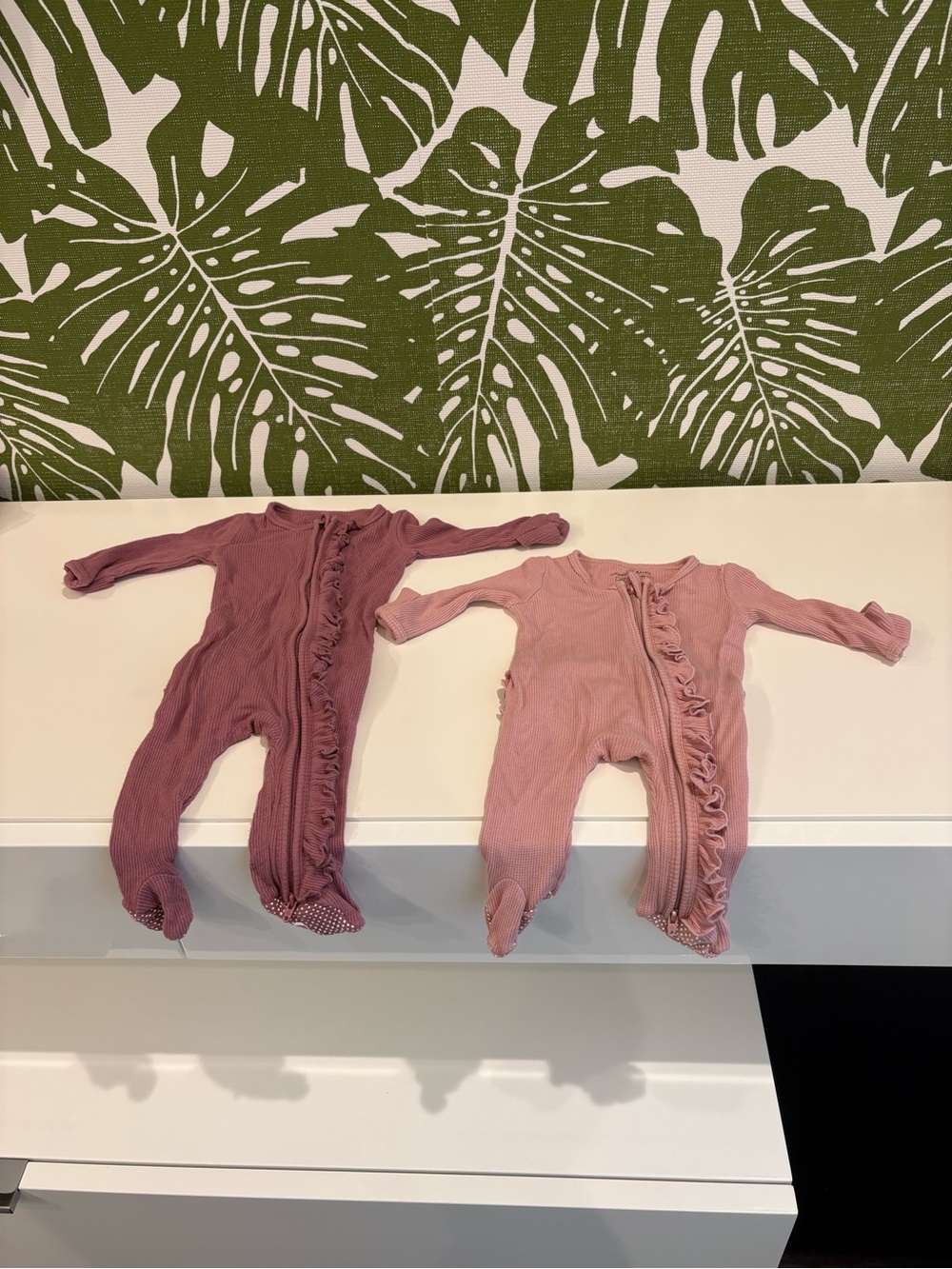 Two Caden Lane Ruffle Zip One-Piece Footies in Dusty Mauve and Blush